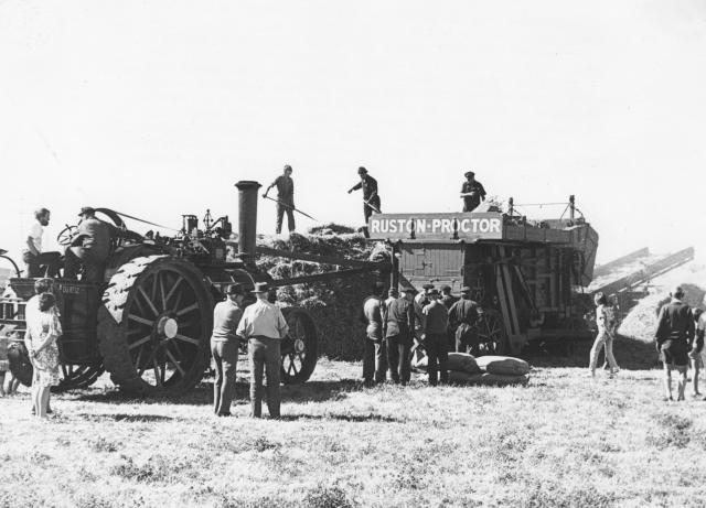 Traction engine and threshing mill
