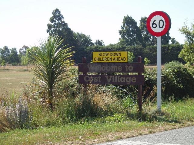 Welcome to Cust Village sign