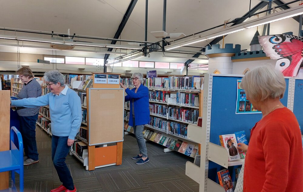 Volunteers shelving at the Rangiora Library, 25 October 2022