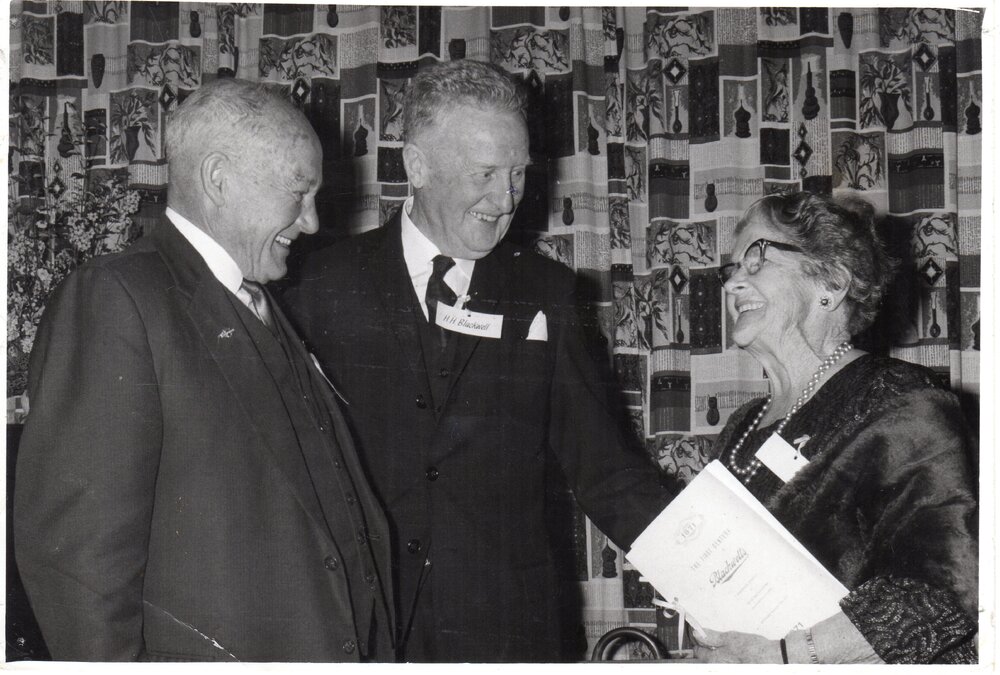 Mr. H. H. Blackwell (centre), with early staff  members, Mr Gilbert Hirst and Mrs Estelle Evans