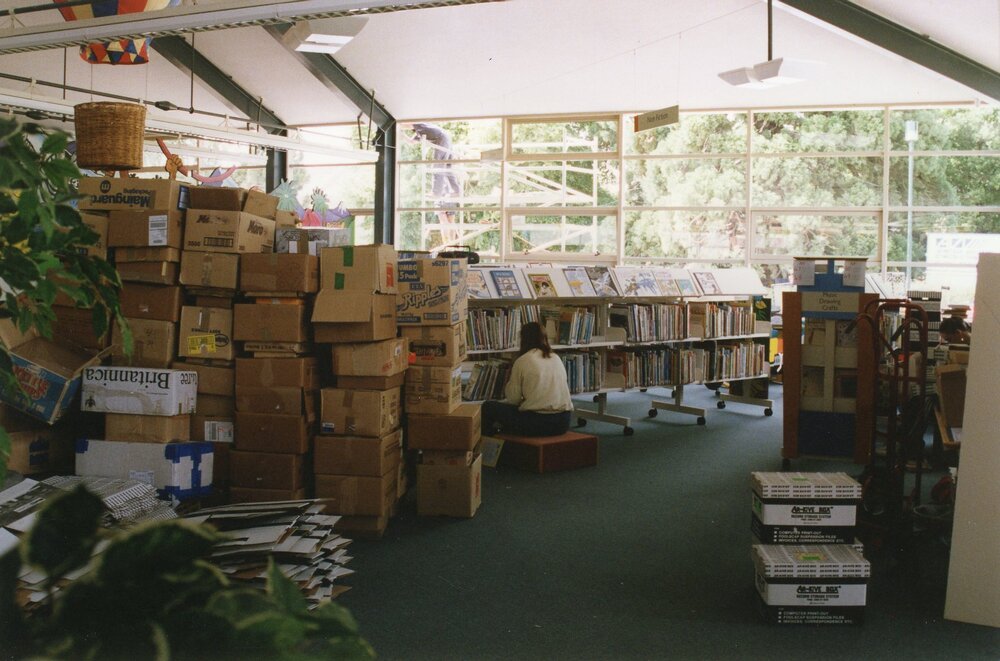 Librarian Julie Schofield shelf-reading in the Trevor Inch Memorial Library, 4 December 1996