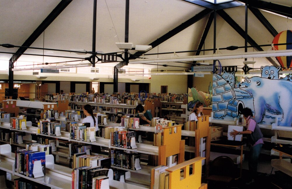 Stocking shelves in the newly-built Trevor Inch Memorial Library, 4 December 1996