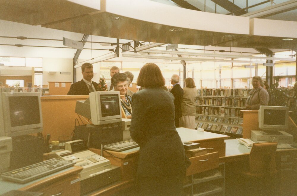 Waimakariri District Mayor Janice Skurr at the front desk of the newly-built Trevor Inch Memorial Library, c. December 1996