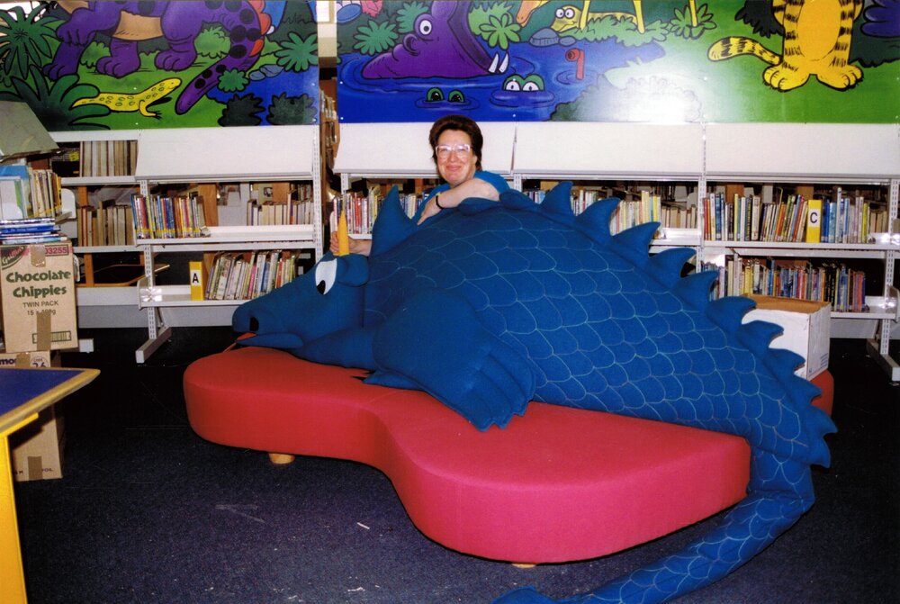 Children's librarian Lynda Seaton, and the dragon, ahead of the Trevor Inch Memorial Library's official opening, 4 December 1996