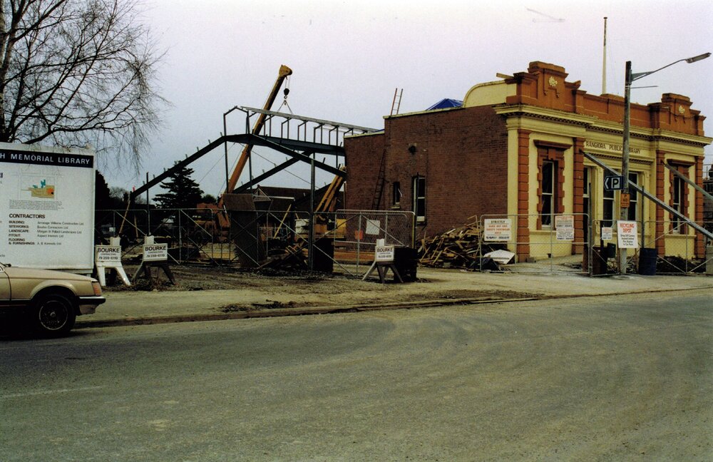 The Trevor Inch Memorial Library framework in construction behind the old Rangiora Public Library building, 15 August 1996