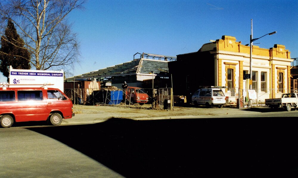 The Trevor Inch Memorial Library roof in construction behind the old Rangiora Public Library, 20 September 1996