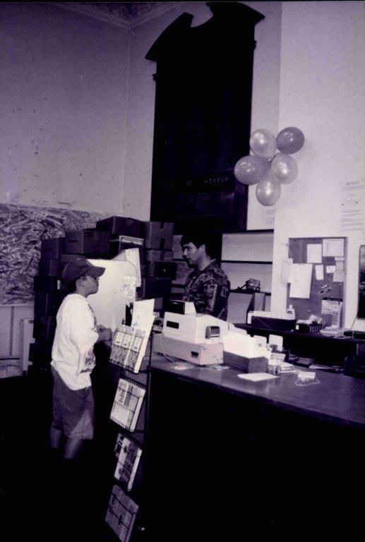 Librarian Mark O'Connell at work in the old Rangiora Public Library, c. May 1996