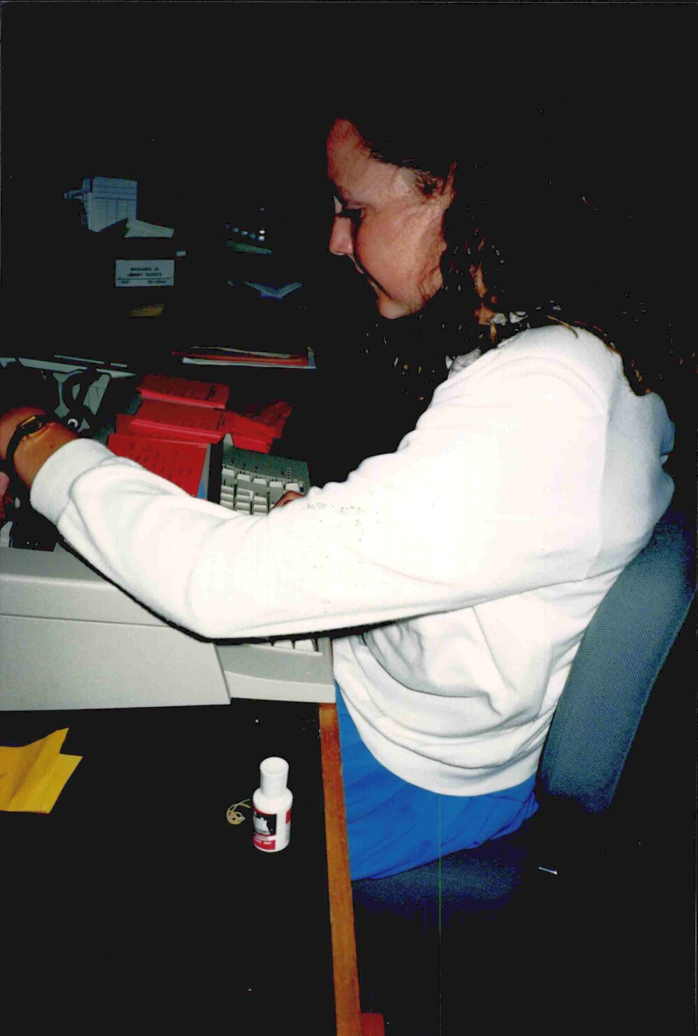 Librarian Nicki Chaston at work in the old Rangiora Public Library, c. November 1990