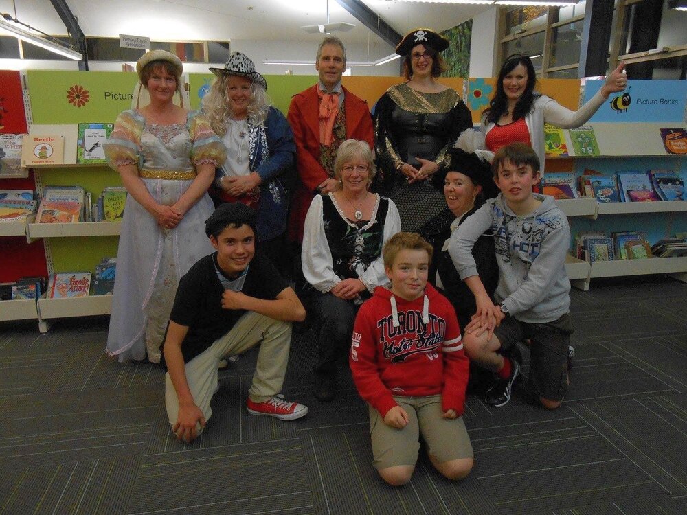 Waimakariri Libraries staff with children, dressed up for KidsFest Quiz Night at the Trevor Inch Memorial Library, c. 2015