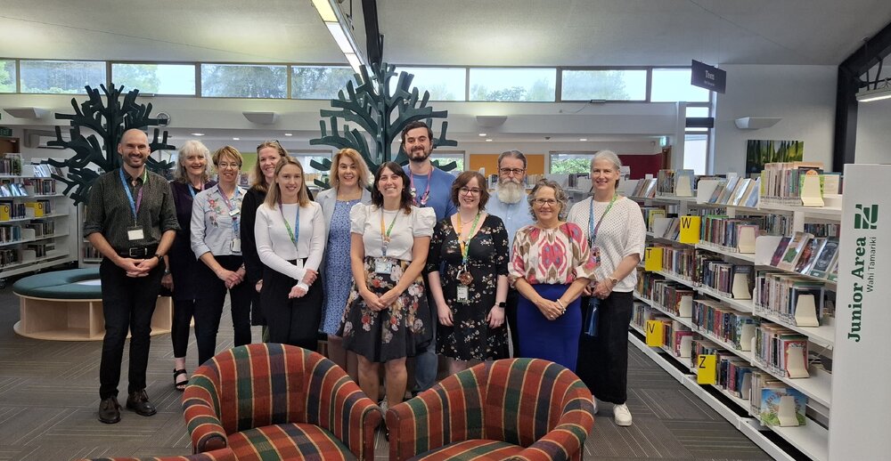 Staff at the re-opening of the Trevor Inch Memorial Library, following the instalment of new shelving and fittings, 31 March 2025