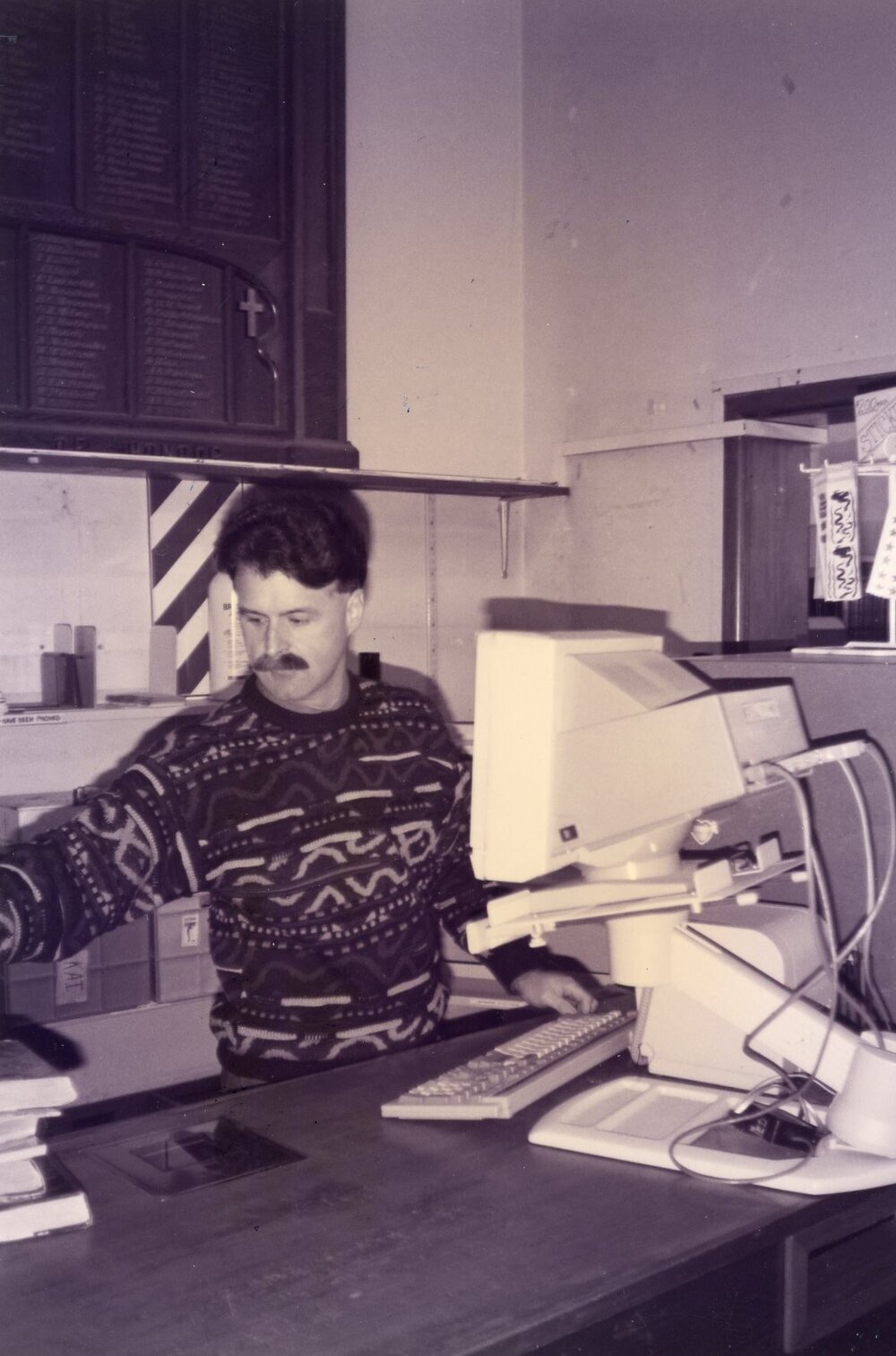 Librarian Richard Shepherd at work in the old Rangiora Public Library, c. 1996
