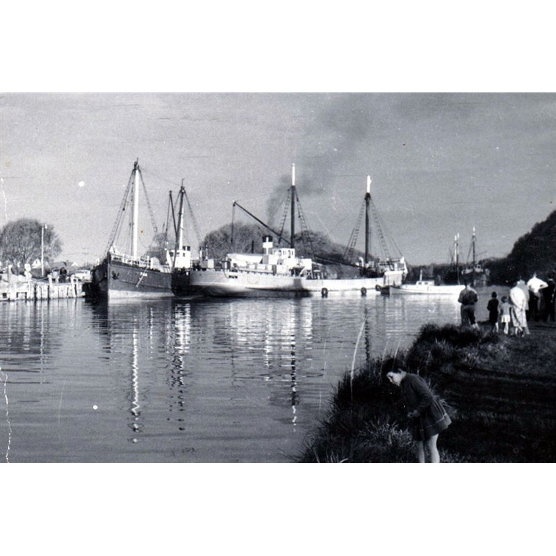 Kaiapoi Port, with people watching the activity