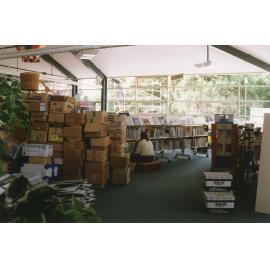 Librarian Julie Schofield shelf-reading in the Trevor Inch Memorial Library, 4 December 1996