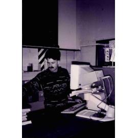 Librarian Richard Shepherd at work in the old Rangiora Public Library, c. 1996