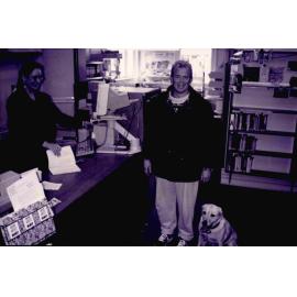 Librarian Debbie Lambert issuing the last book in the old Rangiora Public Library on Percival Street, c. May 1996