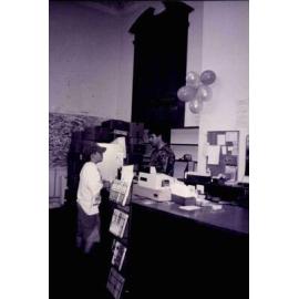 Librarian Mark O'Connell at work in the old Rangiora Public Library, c. May 1996