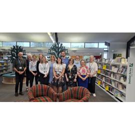 Staff at the re-opening of the Trevor Inch Memorial Library, following the instalment of new shelving and fittings, 31 March 2025